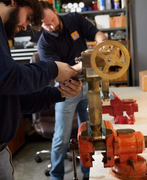 Technician working on valve